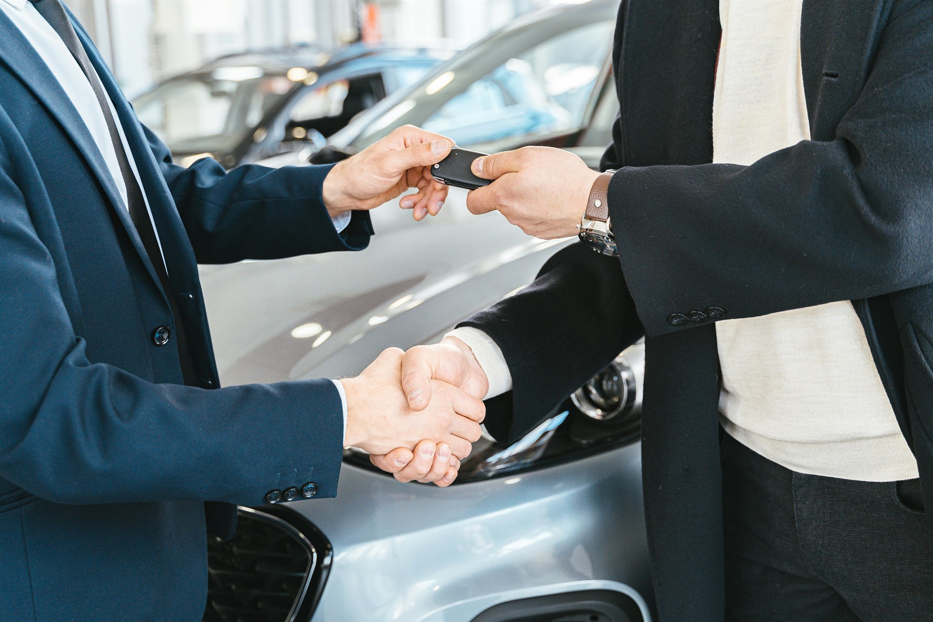 Photo by Antoni Shkraba Studio: https://www.pexels.com/photo/a-person-giving-a-car-key-to-another-person-while-shaking-his-hands-7144207/