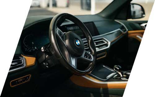 BMW interior dashboard and steering wheel detail at Warrington Auto Sales luxury used car dealership