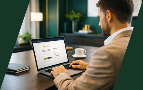 Professional reviewing auto financing pre-approval on a laptop in a modern luxury office setting