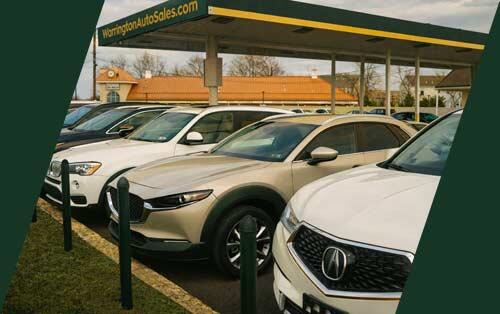 Row of quality pre owned vehicles at Warrington Auto Sales dealership lot in Warrington Pennsylvania