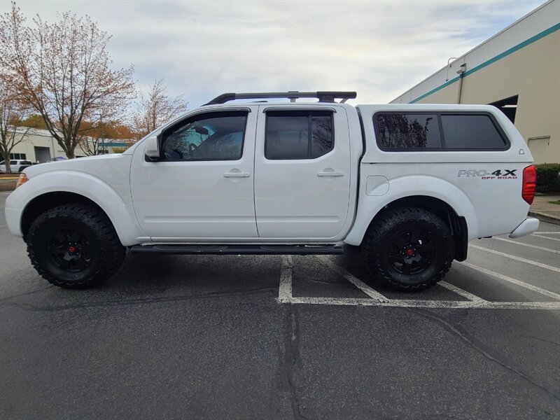 2011 Nissan Frontier PRO-4X / 4X4 / CREW CAB / V6 4.0 L / NEW TIRES  / SUNROOF / HEATED LEATHER / CANOPY / LOW 90K MILES !! - Photo 3 - Portland, OR 97217