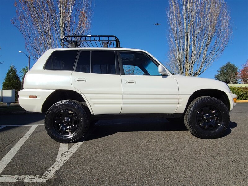 1999 Toyota RAV4 4X4 / Automatic / SUN ROOF / LEATHER SEATS /  / BRAND NEW TIMING BELT & WATER PUMP / NEW TIRES / NEW LIFT !!! - Photo 4 - Portland, OR 97217