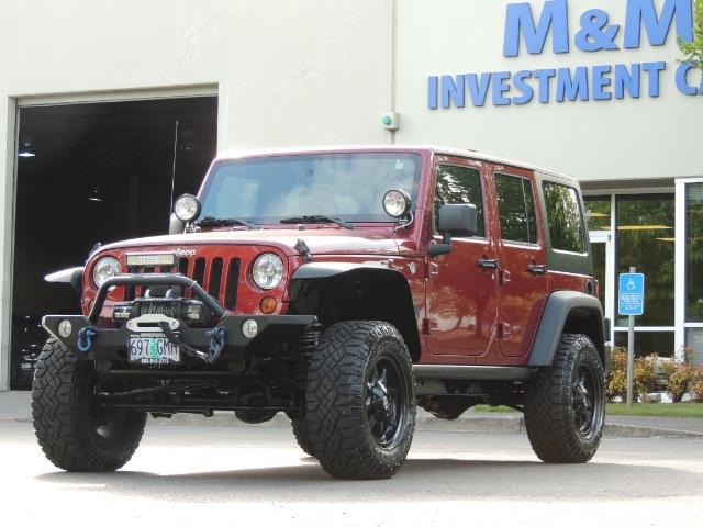2011 Jeep Wrangler Unlimited Sport / 4X4 / 6-SPEED / LIFTED   - Photo 1 - Portland, OR 97217