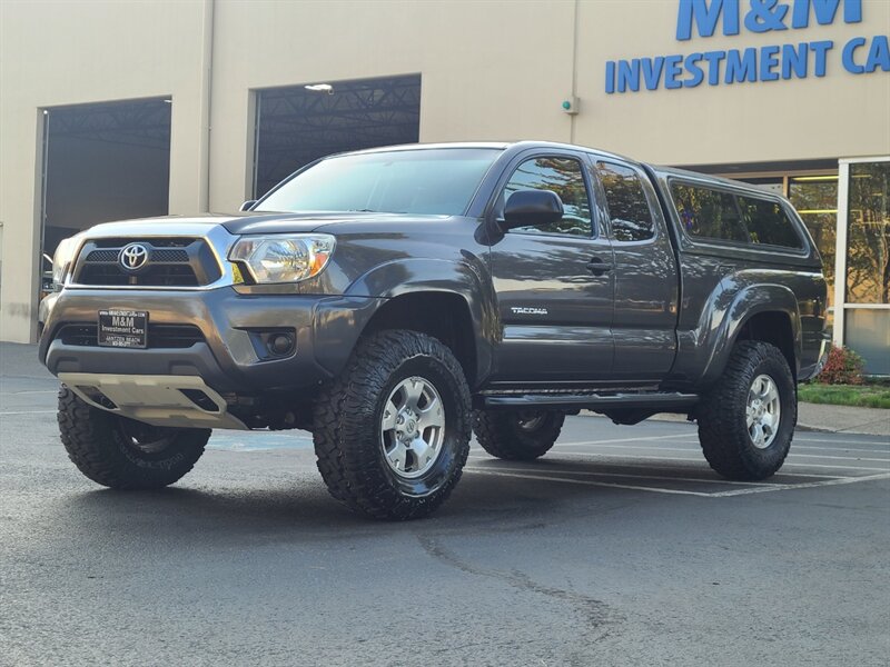 2012 Toyota Tacoma ACCESS CAB 4X4 / 6-FT Bed / BACK-UP CAM / 1-OWNER  / MATCHING CANOPY / NEW TIRES / NEW LIFT - Photo 1 - Portland, OR 97217