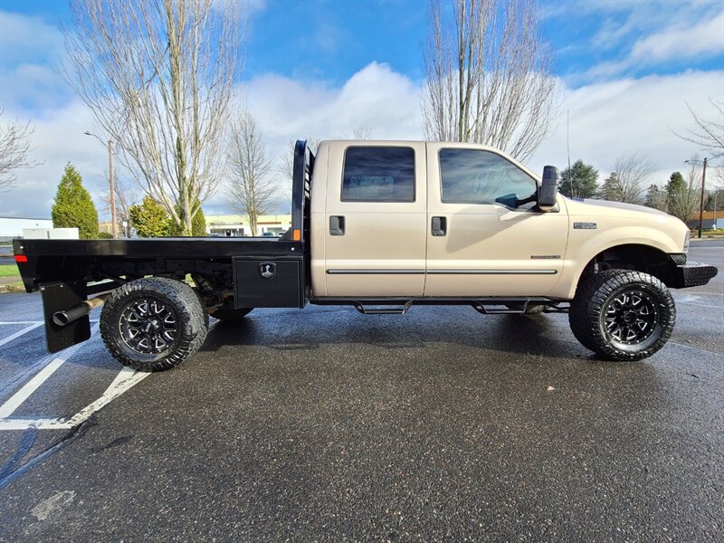 1999 Ford F-350 Super Duty / FLAT BED / Crew Cab / 4X4 / 7.3L /  Powerstroke TURBO DIESEL / 6 SPEED MANUAL / 1-TON / LIFTED - Photo 4 - Portland, OR 97217