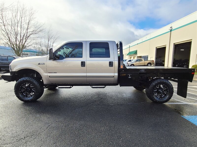 1999 Ford F-350 Super Duty / FLAT BED / Crew Cab / 4X4 / 7.3L /  Powerstroke TURBO DIESEL / 6 SPEED MANUAL / 1-TON / LIFTED - Photo 3 - Portland, OR 97217