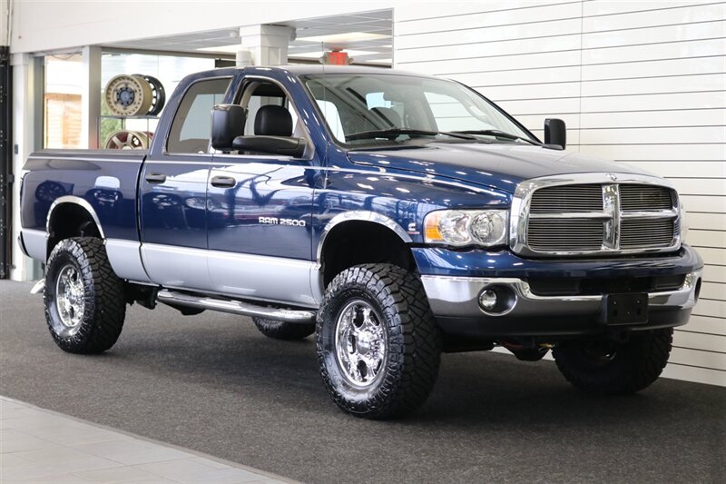 2003 Dodge Ram 2500 SLT 4dr Quad Cab  1-OWNER* 100% RUST FREE* SHORT BED HIGH OUTPUT CUMMINS 5.9L* 6-SPEED MANUAL* LEATHER* REAR AIRBAGS* BANKS EXAUST BRAKE* IN BED AUX FUEL TANK* ALL RECORDS SINCE NEW* WINDOW STICKER* 2-KEYS* 35