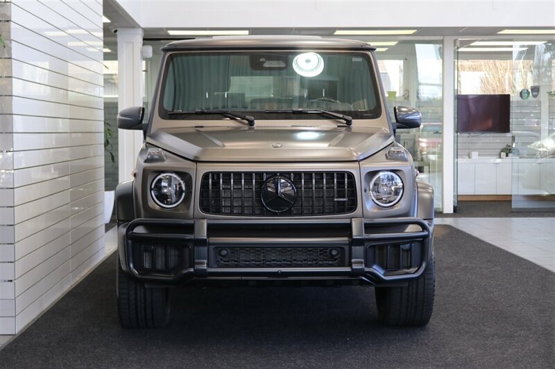 2025 Mercedes-Benz AMG G 63  1-OWNER* FULL PPF ON FRONT NOSE* MONZA GREY MAGNO-CARBON FIBER INTERIOR TRIM-22 " AMG WHEELS-EXCLUSIVE INTERIOR PLUS-AMG NIGHT PACKAGE MAGNOAMG PERFORMANCE STEERING WHEEL-BLACK MAGNO ROOF* - Photo 8 - Portland, OR 97230