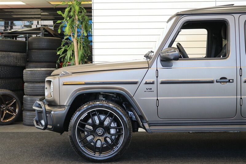2025 Mercedes-Benz AMG G 63  1-OWNER* FULL PPF ON FRONT NOSE* MONZA GREY MAGNO-CARBON FIBER INTERIOR TRIM-22 " AMG WHEELS-EXCLUSIVE INTERIOR PLUS-AMG NIGHT PACKAGE MAGNOAMG PERFORMANCE STEERING WHEEL-BLACK MAGNO ROOF* - Photo 26 - Portland, OR 97230