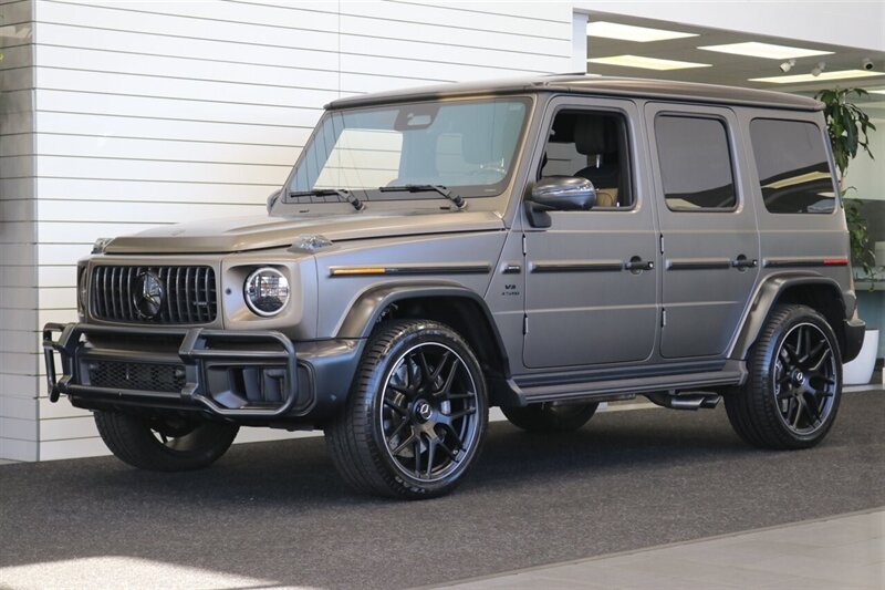 2025 Mercedes-Benz AMG G 63  1-OWNER* FULL PPF ON FRONT NOSE* MONZA GREY MAGNO-CARBON FIBER INTERIOR TRIM-22 " AMG WHEELS-EXCLUSIVE INTERIOR PLUS-AMG NIGHT PACKAGE MAGNOAMG PERFORMANCE STEERING WHEEL-BLACK MAGNO ROOF* - Photo 3 - Portland, OR 97230