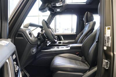 2025 Mercedes-Benz AMG G 63  1-OWNER* FULL PPF ON FRONT NOSE* MONZA GREY MAGNO-CARBON FIBER INTERIOR TRIM-22 " AMG WHEELS-EXCLUSIVE INTERIOR PLUS-AMG NIGHT PACKAGE MAGNOAMG PERFORMANCE STEERING WHEEL-BLACK MAGNO ROOF* - Photo 48 - Portland, OR 97230