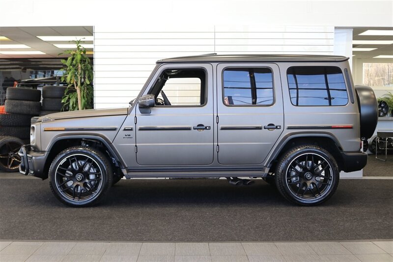 2025 Mercedes-Benz AMG G 63  1-OWNER* FULL PPF ON FRONT NOSE* MONZA GREY MAGNO-CARBON FIBER INTERIOR TRIM-22 " AMG WHEELS-EXCLUSIVE INTERIOR PLUS-AMG NIGHT PACKAGE MAGNOAMG PERFORMANCE STEERING WHEEL-BLACK MAGNO ROOF* - Photo 4 - Portland, OR 97230