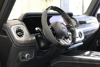 2025 Mercedes-Benz AMG G 63  1-OWNER* FULL PPF ON FRONT NOSE* MONZA GREY MAGNO-CARBON FIBER INTERIOR TRIM-22 " AMG WHEELS-EXCLUSIVE INTERIOR PLUS-AMG NIGHT PACKAGE MAGNOAMG PERFORMANCE STEERING WHEEL-BLACK MAGNO ROOF* - Photo 44 - Portland, OR 97230