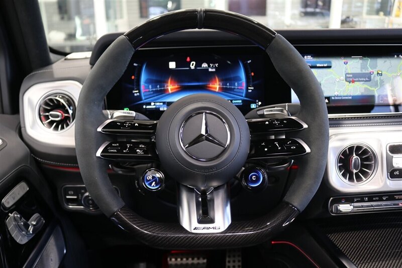 2025 Mercedes-Benz AMG G 63  1-OWNER* FULL PPF ON FRONT NOSE* MONZA GREY MAGNO-CARBON FIBER INTERIOR TRIM-22 " AMG WHEELS-EXCLUSIVE INTERIOR PLUS-AMG NIGHT PACKAGE MAGNOAMG PERFORMANCE STEERING WHEEL-BLACK MAGNO ROOF* - Photo 21 - Portland, OR 97230