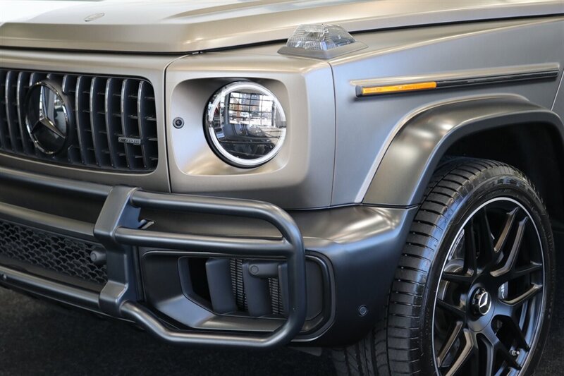2025 Mercedes-Benz AMG G 63  1-OWNER* FULL PPF ON FRONT NOSE* MONZA GREY MAGNO-CARBON FIBER INTERIOR TRIM-22 " AMG WHEELS-EXCLUSIVE INTERIOR PLUS-AMG NIGHT PACKAGE MAGNOAMG PERFORMANCE STEERING WHEEL-BLACK MAGNO ROOF* - Photo 10 - Portland, OR 97230