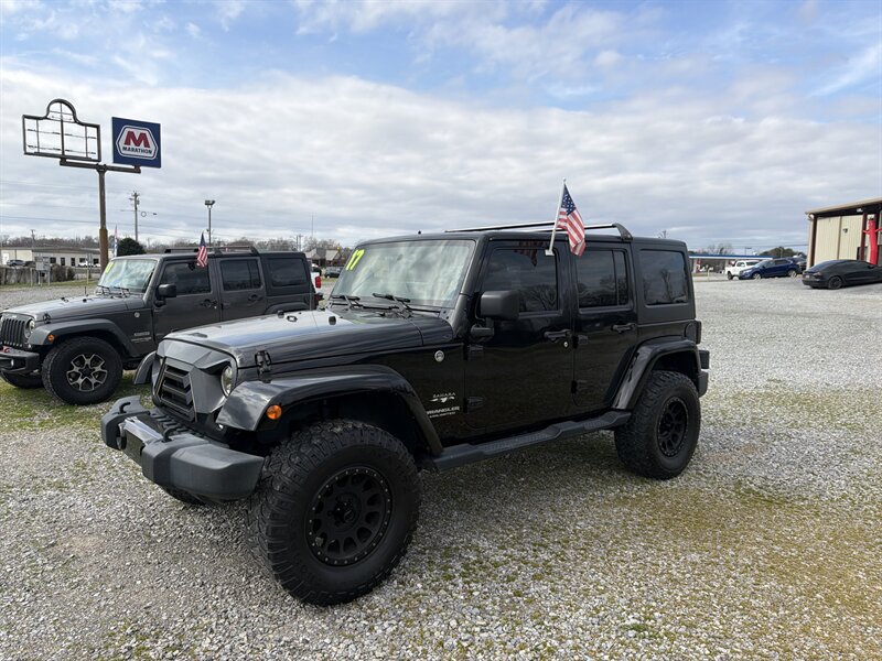 2017 Jeep Wrangler Unlimited Sahara   - Photo 1 - Madisonville, TN 37354