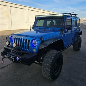 2015 Jeep Wrangler Unlimited Freedom Edition - Photo 2 - West Haven, UT 84401