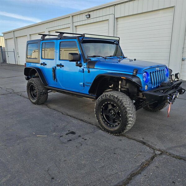 2015 Jeep Wrangler Unlimited Freedom Edition   - Photo 1 - West Haven, UT 84401