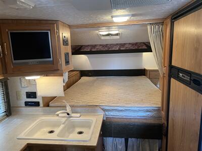 2005 SNOW RIVER TRUCK CAMPER 906 dinette slide  Overhead camper - Photo 6 - Albuquerque, NM 87108